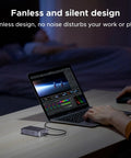 Slick Beast Mode M2 Nvme Enclosure For External Solid State Drives compatible with Thunderbolt 4 and USB4 beside laptop with video editing.