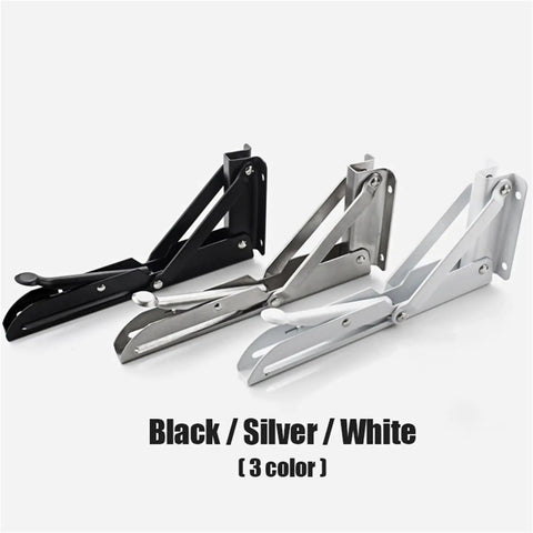 Three colors of heavy-duty folding shelf brackets, black, silver, and white, shown side by side with collapsible mounts.