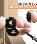 Close-up of Heavy Duty 40 Piece Black Stainless Steel L Bracket Corner Brace Set with smooth edge feature near fingers.