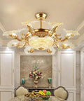 Luxury European Ceiling Fan Light With Remote Control And Invisible Blade Fan Chandelier In Trace Gold Finish Boasting 8 E27 Bulbs And 42 Inch Size For Epic Vibe above a dining table in an elegant room.