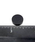 Half Inch Wide Round Silicone Rubber Bumper Feet Pads One Eighth Inch Thick With Adhesive Backing next to ruler for size reference