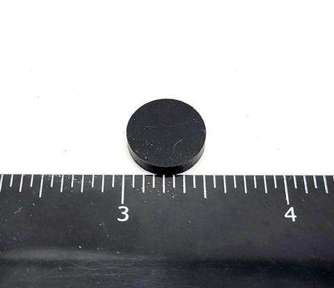 Half Inch Wide Round Silicone Rubber Bumper Feet Pads One Eighth Inch Thick With Adhesive Backing next to ruler for size reference