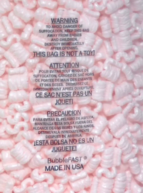 Pink Anti Static Packing Peanuts 3.5 Cubic Feet 22.5 Gallons Interlocking S Shaped Cushioning Pellets with warning text