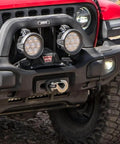 Red off-road vehicle front with AEV Winch Hook Isolator Fairlead Protector Hook Stopper For Off Road Winching Reduces Rattle And Vibration Protects Fairlead Durable Polyurethane Recovery Accessory on bumper