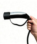 All Season Silicone Cover For Tesla Nacs Ev Charger Port on charging handle, showcasing flexible seal design for easy use.
