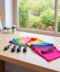 12 Piece Black Zipper Repair Kit With Removable Sliders For Quick Fix On Clothes, Backpacks And Jackets displayed on a table