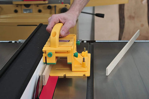Hand using Knuckle Saver 3D Pushblock And One Eighth Inch Grip Leg Combo For Table Saw Safety on narrow wood stock.