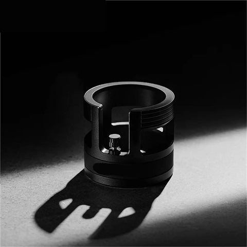Game Changing 58mm Espresso Portafilter Station Keeps Your Gear Locked In Place During Tamping with a sturdy black metal design.