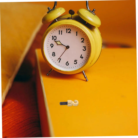 Grandfather Clock Weight Replacement Hook for DIY Restoration Projects with alarm clock, durable metal hook visible on table