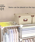 Heavy Duty Portable Wardrobe Closet Steel Pipe Frame And No Sweat Assembly Garment Storage Rack For Bedroom Clothes Shoes Hats Built Tough To Last with items on top and shelves of folded clothes.