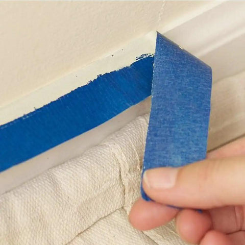 Blue Painters Tape 180 Yards Removable Masking Tape For Painting And DIY Projects With Sharp Edges For Walls Wood Glass And Trim Great For Classrooms Three Rolls 0.7 Inch By 60 Yards Each being peeled from a wall
