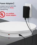 Power adapter connected to the Top Rated 23.6 Inch Heavy Duty Motorized Electric Turntable With Remote Control Rotating Photography Platform.