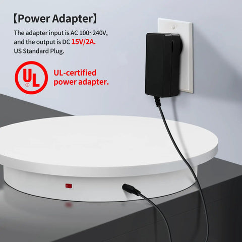 Power adapter connected to the Top Rated 23.6 Inch Heavy Duty Motorized Electric Turntable With Remote Control Rotating Photography Platform.