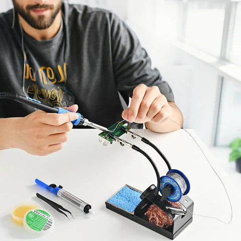 Heated 100W Soldering Iron Kit With LCD Temp Readout And Auto Sleep in use on PCB with tips, flux, tin wires, and helping hands