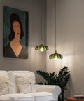 Chic Green Glass Plug In Pendant Light Fixture For Kitchen Island And Dining Room illuminating a cozy living room setting.