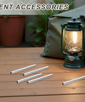 Five Pack Aluminum Tent Pole Repair Sleeves Replacement Connectors for Camping Poles on wooden table near lantern