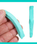 Pro Grade Watch Cleaning Putty Kit For Precision Movement Cleanup and Dial Dust Removal in hand with willow sticks and adhesive tools