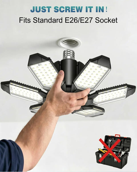 Hand installing 100W LED Garage Light With 6 Adjustable Panels Deformable LED Shop Lights in E26 E27 socket.