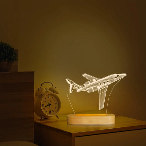 Lit 3D Airplane Illusion Night Light With Dimmable LED Wood Base on bedside, USB Powered Desk Lamp with airplane art.