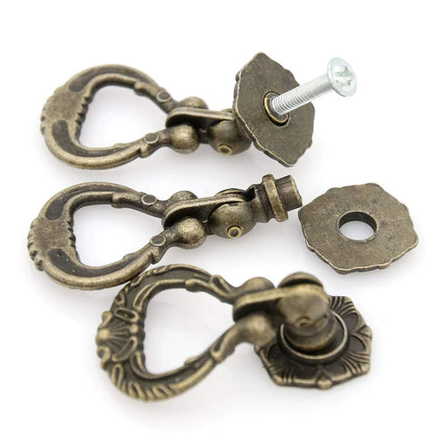 Set Of 4 Vintage Antique Brass Pendant Ring Pull Handles With Single Mounting Hole for drawers, close-up view showing screw detail.