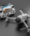 Close-up of GPS Drone With Screen Remote Control, Brushless Motors, Real Time Obstacle Avoidance, Optical Flow Localization, Auto Return, One Key Airdrop, Dual Batteries, White Edition on gray surface.