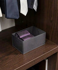 Super Sturdy Foldable Drawer Clothing Organizer Set Eight Piece Gray Fabric Wardrobe Dividers with ties in a storage bin.