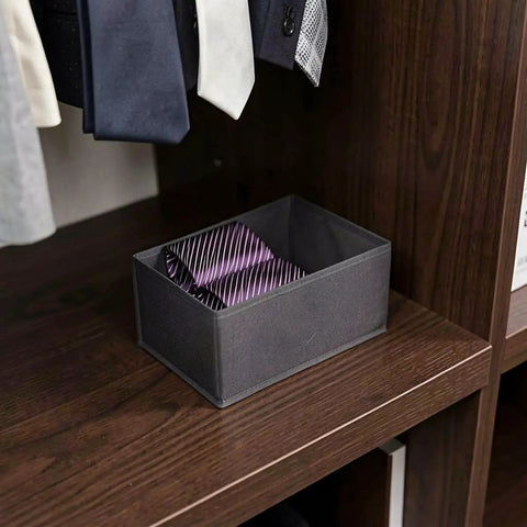 Super Sturdy Foldable Drawer Clothing Organizer Set Eight Piece Gray Fabric Wardrobe Dividers with ties in a storage bin.
