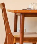 Tapered Wood Plugs For Screw Holes With Button Plug Head on a wooden chair and table, easy glue install, tight secure fit for DIY projects.