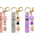 Personalized Birth Flower Sketch Leather Keychain With Beaded Accents And Bombproof Metal Hardware Precision Engraved, three colors.