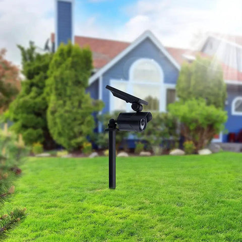 Solar Motion Sensor Flood Light With 8 LEDs And 500 Lumen Output For Garage Yard Driveway Pathway installed in garden