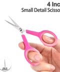 4 Inch Small Detail Scissors, pink-handled stainless steel embroidery scissors held in hand with fine-tip blades