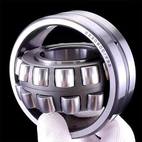 Heavy Duty Self Aligning Roller Bearing 22215 CAK W33 Single Pack showing inner spherical rollers and steel construction.