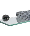 Oil Rubbed Bronze Bathroom Glass Shelf, 16 By 5 Inches, 8mm Tempered Glass With 304 Stainless Steel Wall Mount displaying a folded towel.