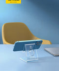 Clear Acrylic Cell Phone Stand For Your Desk And Office displaying a blue phone horizontally on a modern office desk setup