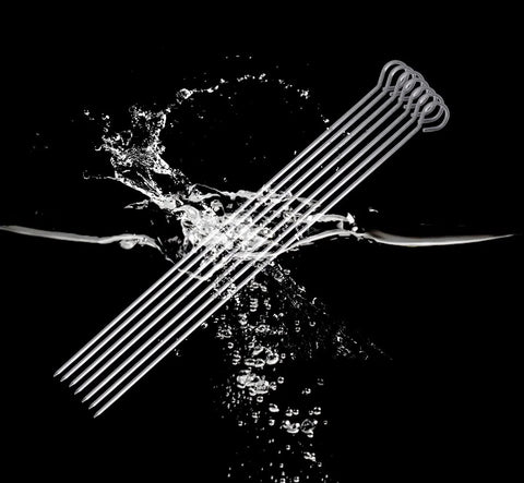 Diagonal view of stainless steel 10-inch barbecue skewers, 12-pack with looped ends