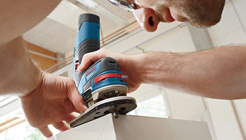 Man using Versatile 30 Piece Carbide Tipped Wood Router Bit Set For Hardwood Softwood And Wood Composite Projects