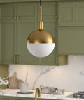 Eight Inch Wide Small Pendant Light With Glass Shade In Brass And White Milk Glass Perfect For Modern Kitchens And Compact Spaces Use In Multiples Over A Kitchen Island For Cohesive Lighting