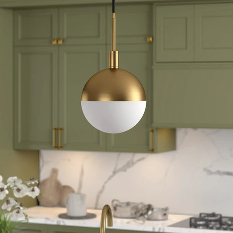 Eight Inch Wide Small Pendant Light With Glass Shade In Brass And White Milk Glass Perfect For Modern Kitchens And Compact Spaces Use In Multiples Over A Kitchen Island For Cohesive Lighting