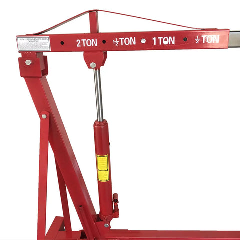 Close-up of Heavy Duty Folding Engine Hoist And Cherry Picker showing hydraulic lift and weight indicators for auto repair.