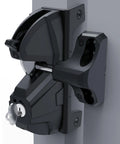Close-up of Top Shelf Locking Gate Latch Black featuring dual side privacy shield, rekeyable cylinder, mounted on a gate post.