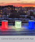 Bloomio Twist Solar Camping Lantern With Bluetooth App Control And Multicolor Led Lights on rooftop at sunset