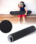 Child holding skateboard with Anti Slip Grip Tape For Skateboards And Scooters, Waterproof Outdoor Tape in 9 by 33 Inches, thick black roll