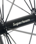 Close-up of hub details on 88mm Carbon Fiber Wheelset For 700C Clincher, 23mm Inner Width, 3K Matte Rim, EN Tested, with Superteam logo.