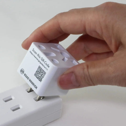 Person holding Must Have US Type A Travel Plug Adapter Converts European UK Indian Australian Chinese Brazilian And Other Plug Types To USA Outlets 2 Prong Ungrounded Travel Converter For North America close to an outlet