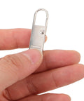 Top Shelf Universal Replacement Zipper Pull Heads 20 Piece Metal Kit with sleek metal pull in hand for luggage repairs.