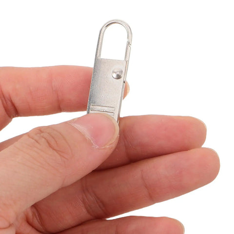 Top Shelf Universal Replacement Zipper Pull Heads 20 Piece Metal Kit with sleek metal pull in hand for luggage repairs.