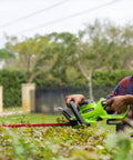 Person using Cordless 24V Hedge Trimmer With 22 Inch Laser Cut Blades, Dual Action Steel, 4Ah Battery And USB Charger Included