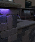 LED Color Changing Hardscape Light 6-Inch Multicolored With Oil Rubbed Bronze Finish on outdoor stone wall