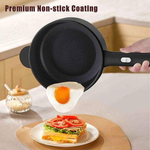 Mini Electric Pot With Nonstick 2L Capacity, Sauté And Steam Function frying an egg, showcasing its nonstick coating in a kitchen.