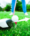 Golf club hitting ball on adjustable tee on grass, showcasing Premium Adjustable Golf Tee Set for Long Drives with 5 Degree Launch Angle